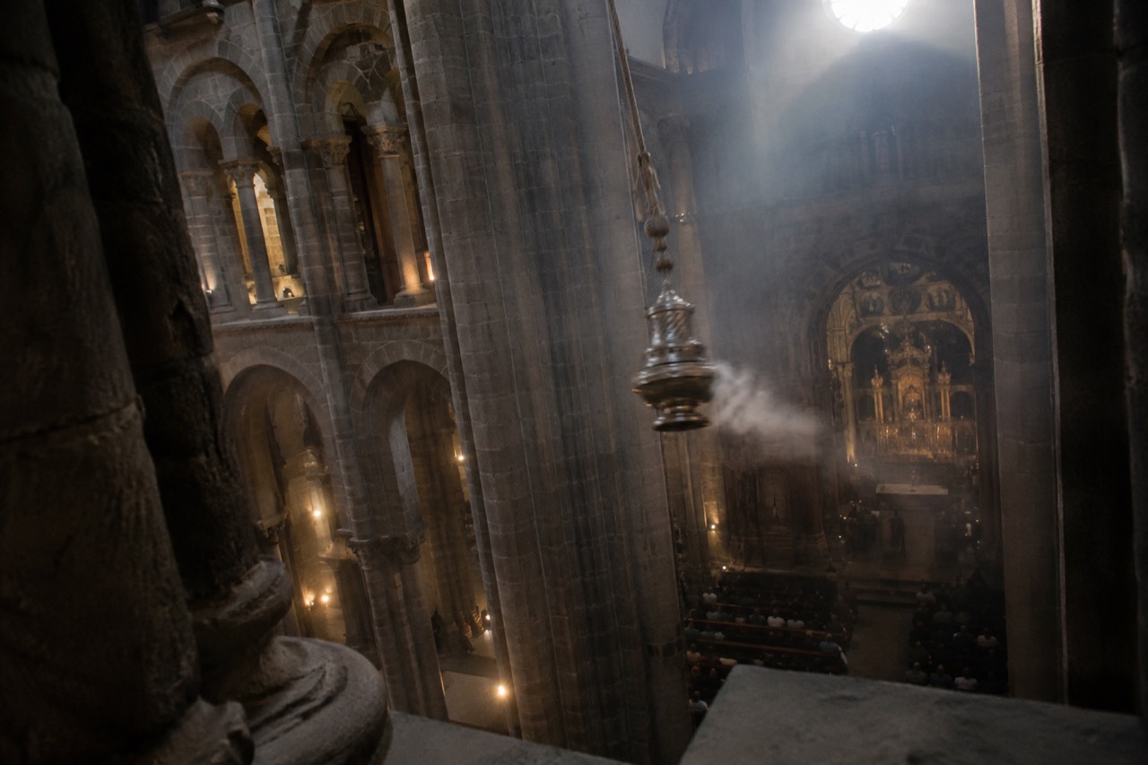 The Botafumeiro censer suspended in the crossing of Santiago de Compostela Cathedral before a swing