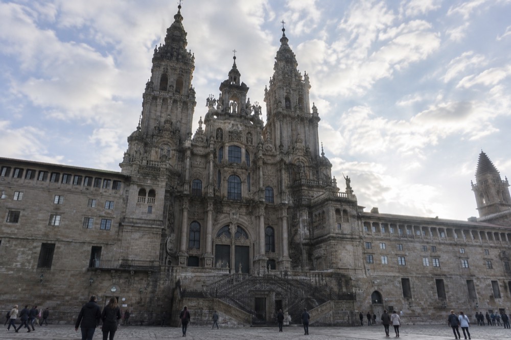 Sunlight falling on the stone floor and columns of the nave inside Santiago de Compostela Cathedral