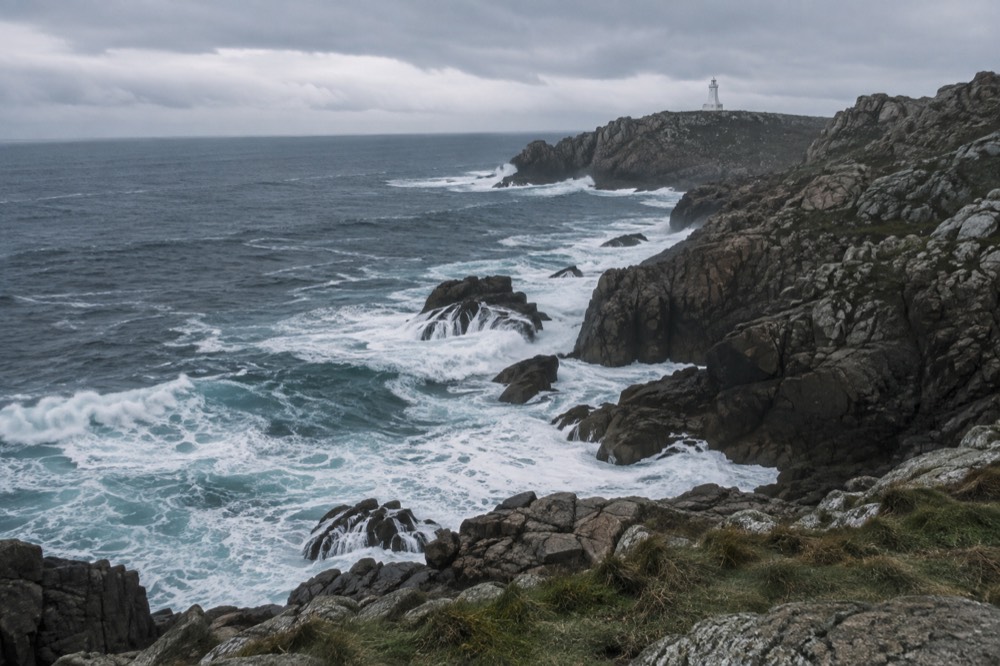 Waves breaking against the rocky cliffs of the Costa da Morte coastline in Galicia