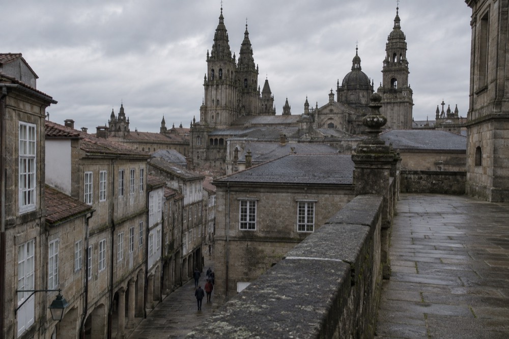 Slate rooftops of the cathedral seen from a stone terrace walkway