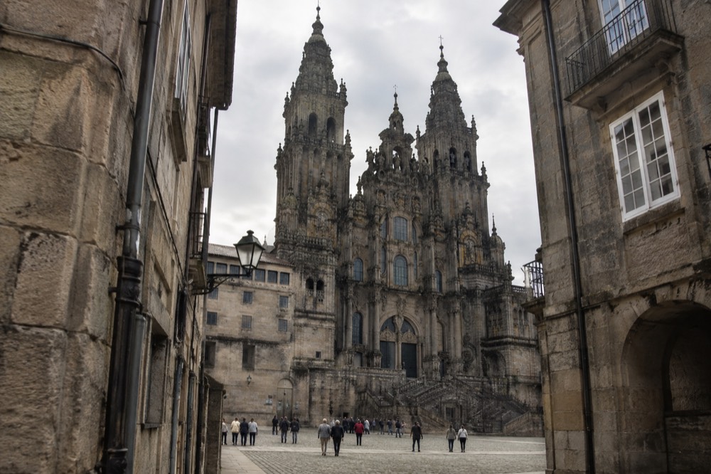 Cathedral towers seen from a narrow old town street in Santiago de Compostela