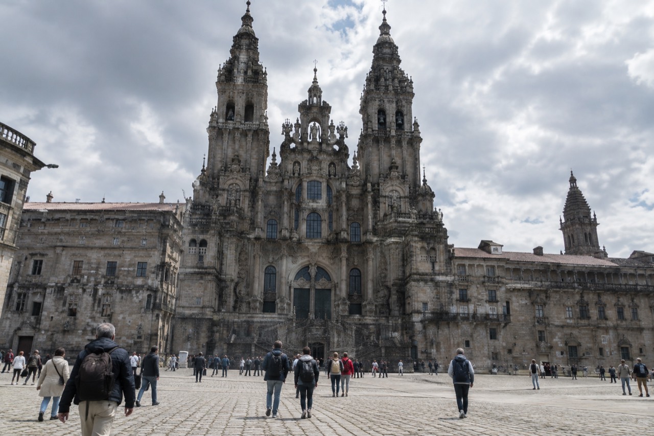 The baroque facade of Santiago de Compostela Cathedral rising above Praza do Obradoiro in morning light