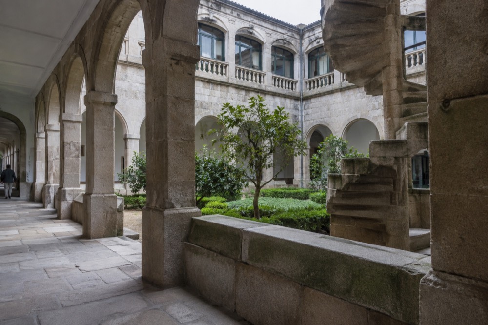Interior cloister with stone arches inside the Museo do Pobo Galego convent building