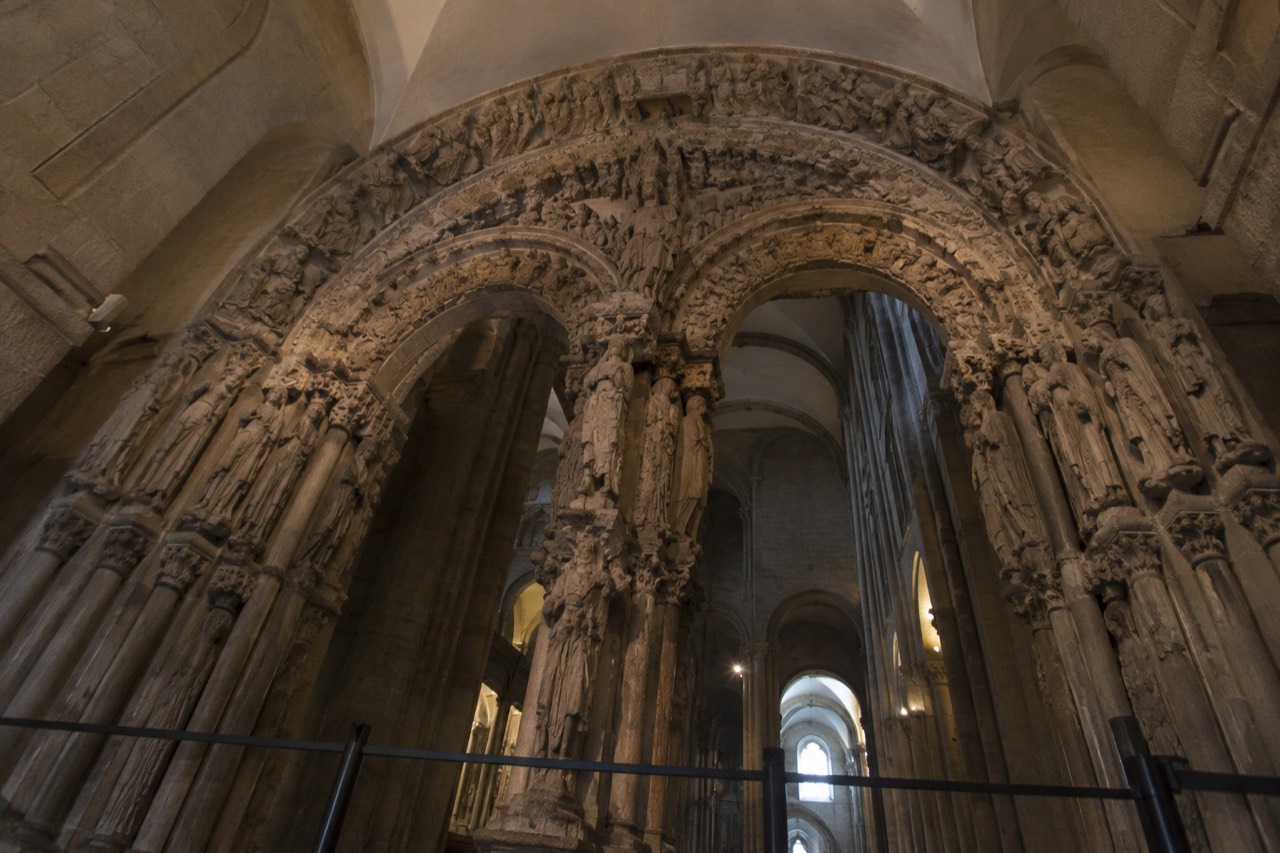 The three carved stone arches of the Portico da Gloria seen from inside Santiago de Compostela Cathedral