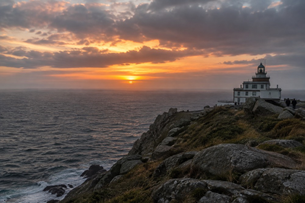 Sunset over the Atlantic Ocean seen from a coastal headland in Galicia