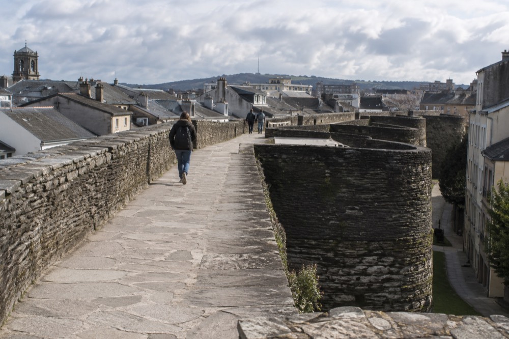 A stone walkway running along the top of the Roman walls of Lugo