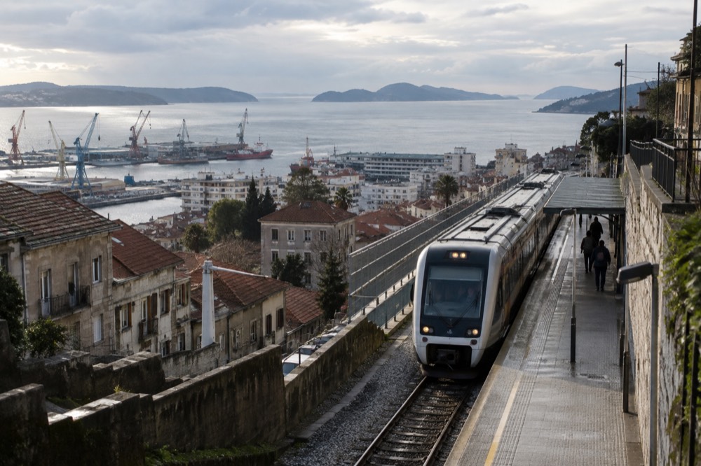 Modern regional train calling at a station platform in Galicia, Spain