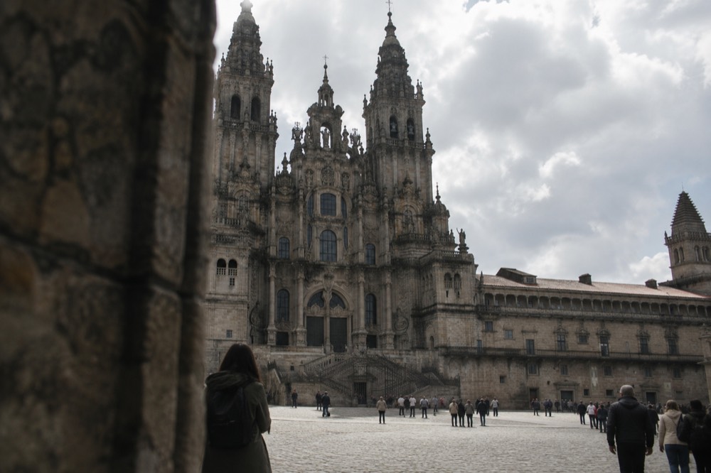 The baroque cathedral facade rising above the wide stone square at Praza do Obradoiro