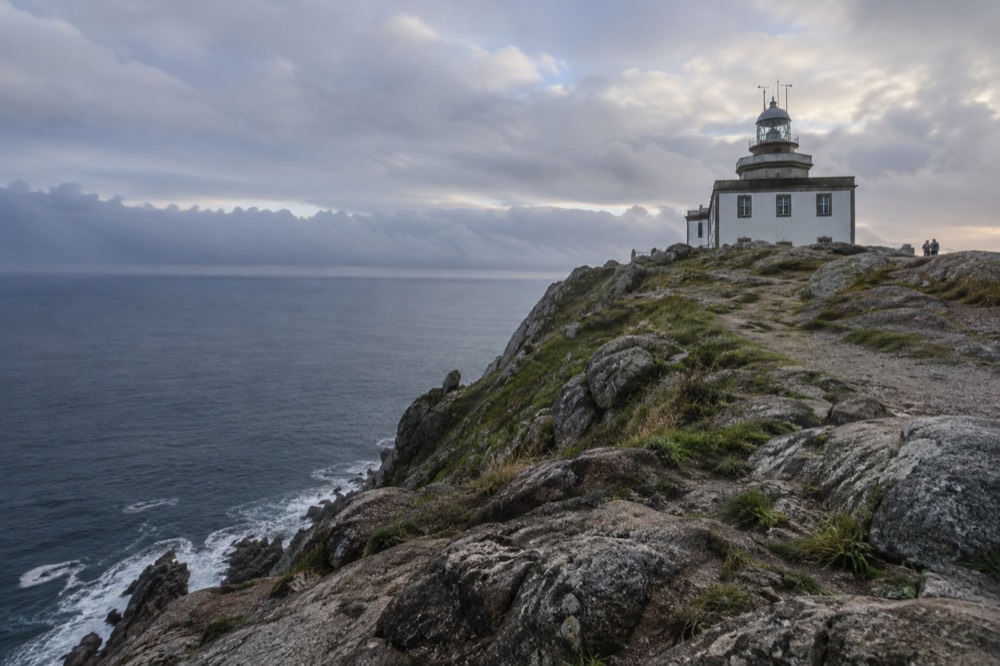 The lighthouse at Cape Finisterre on the Costa da Morte with the Atlantic Ocean beyond