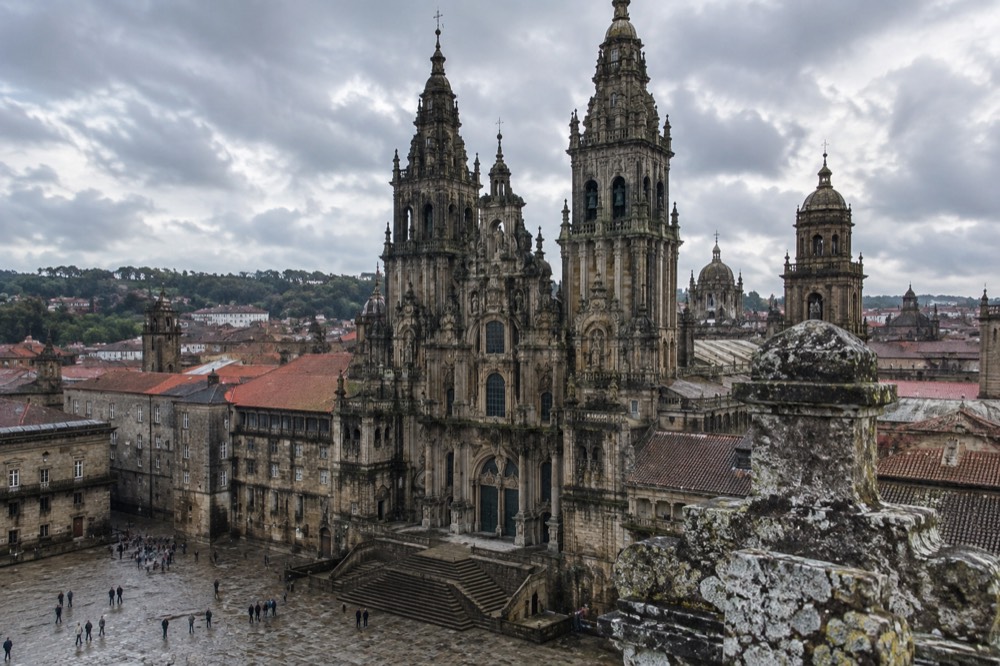 Stone rooftops and towers of Santiago de Compostela Cathedral seen from the guided rooftop visit
