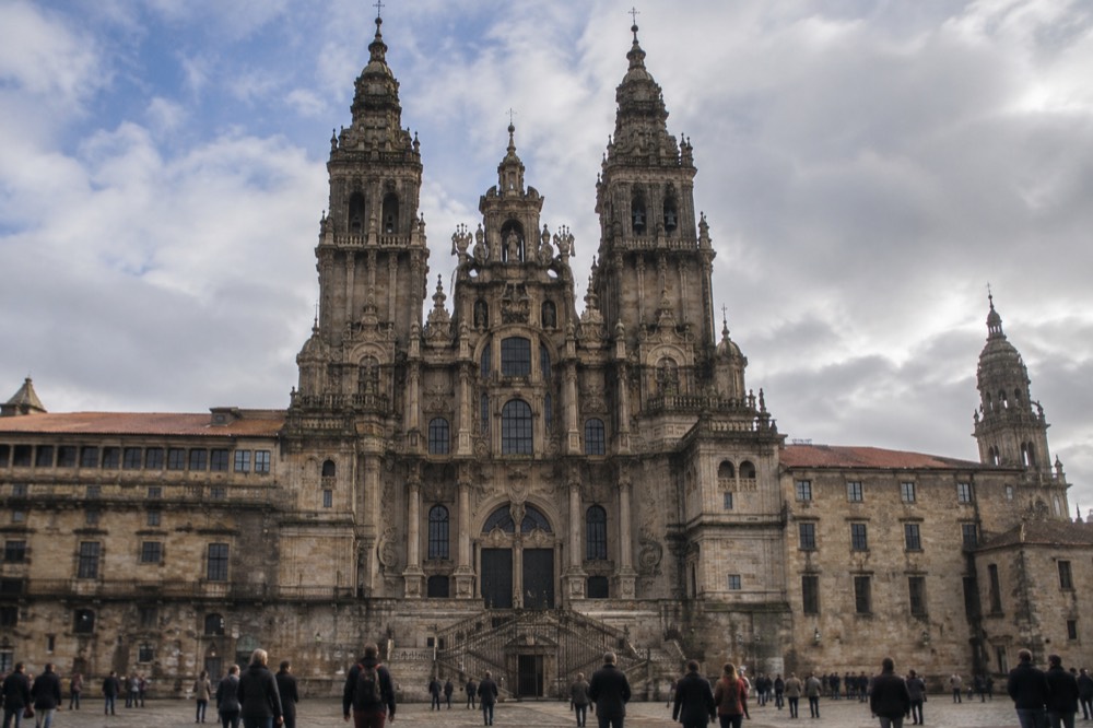 The baroque western facade of Santiago de Compostela Cathedral seen from Praza do Obradoiro square