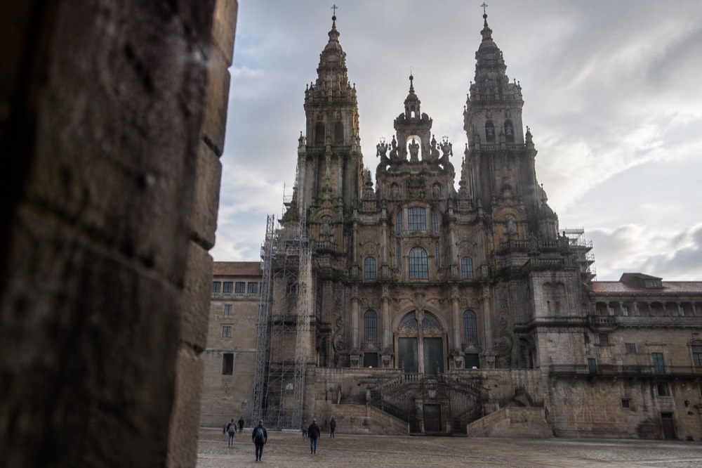 The interior of Santiago de Compostela Cathedral looking up toward the dome and the crossing where scaffolding is installed