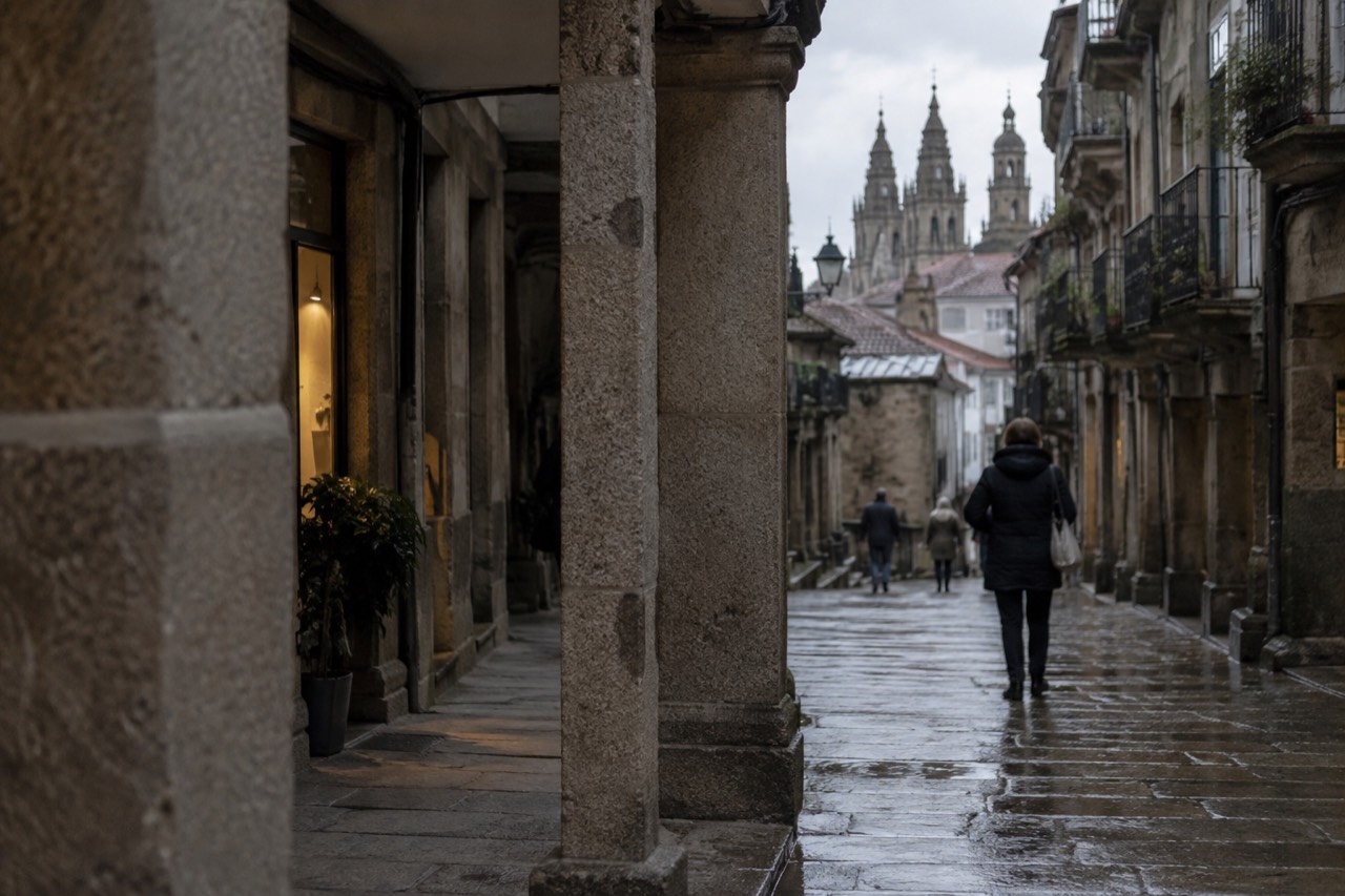 Clouds drifting over the rooftops and towers of Santiago de Compostela's old town on a mild Galician day