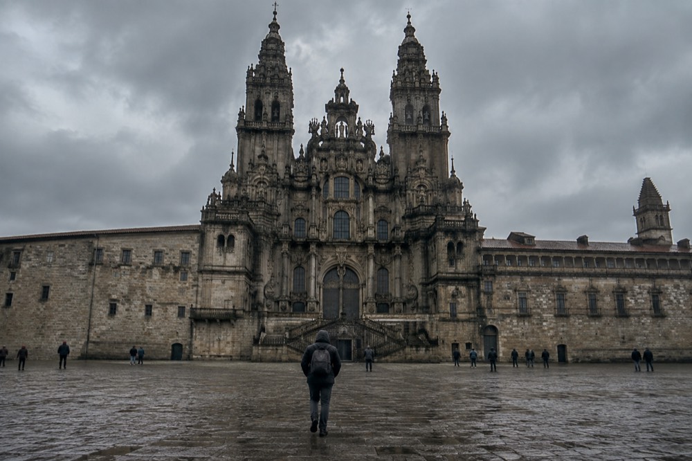 Rain clouds gathering over green hills on the approach to Santiago de Compostela