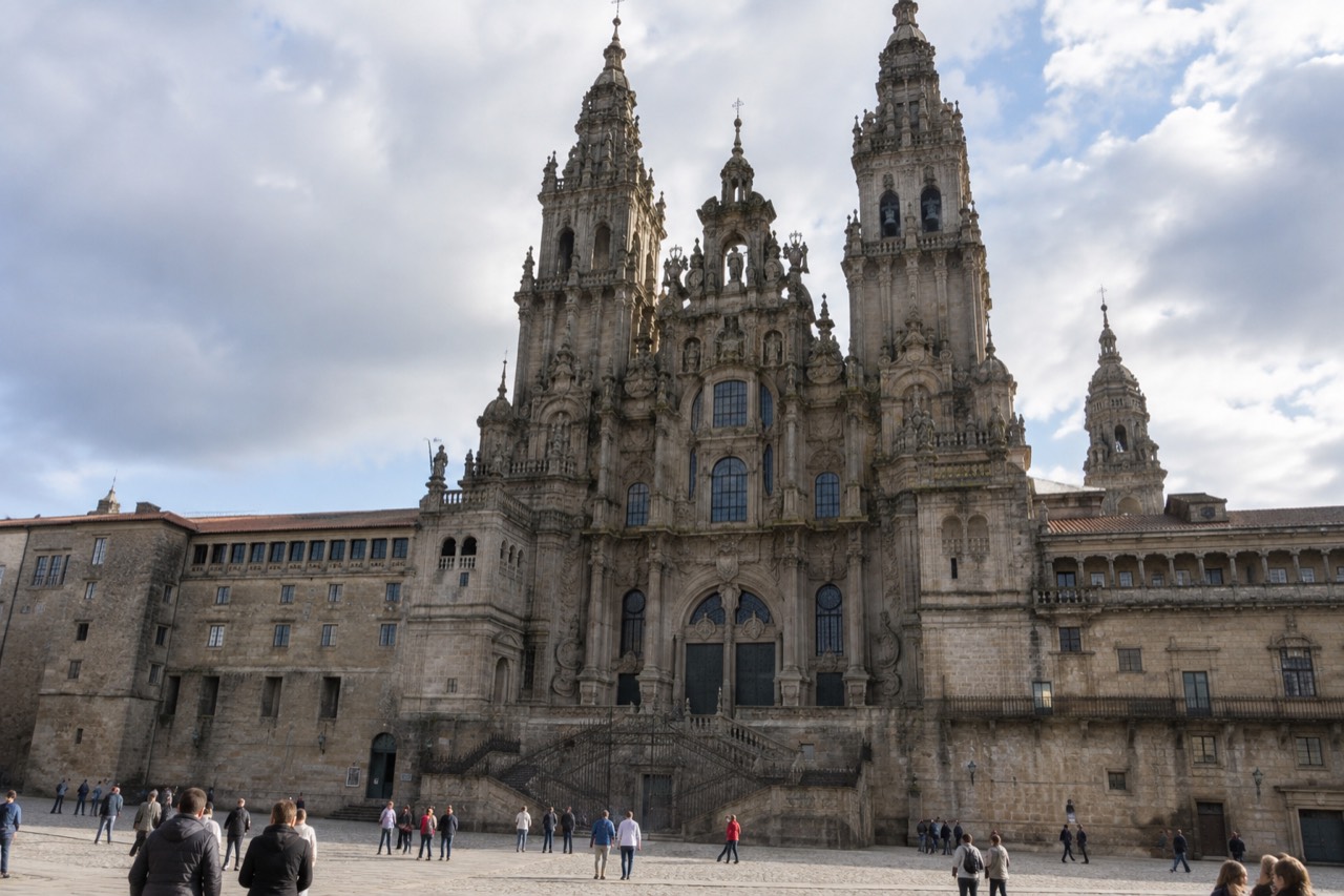 The baroque facade of Santiago de Compostela Cathedral seen from Praza do Obradoiro at golden hour