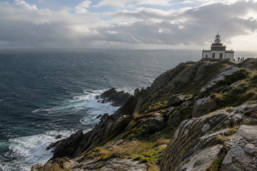 The lighthouse at Fisterra above the Atlantic cliffs at the end of the Costa da Morte